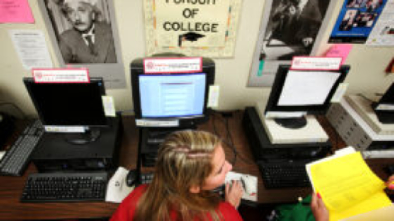 Victoria Kaestner, a senior at Wilson High School in Long Beach, works on her college applications using the Common Application in the career center on the school's campus.  (Photo by Katie Falkenberg/Los Angeles Times via Getty Images)