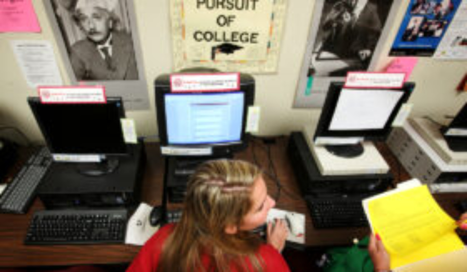 Victoria Kaestner, a senior at Wilson High School in Long Beach, works on her college applications using the Common Application in the career center on the school's campus.  (Photo by Katie Falkenberg/Los Angeles Times via Getty Images)